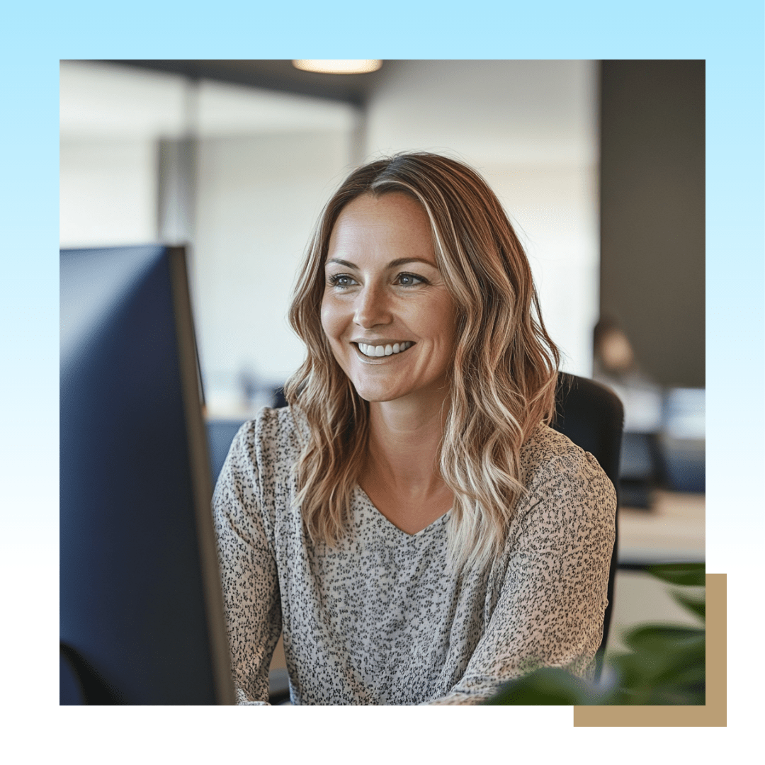 Image of professional woman looking at the computer and smiling